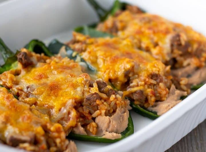 Stuffed Poblanos in a white baking dish