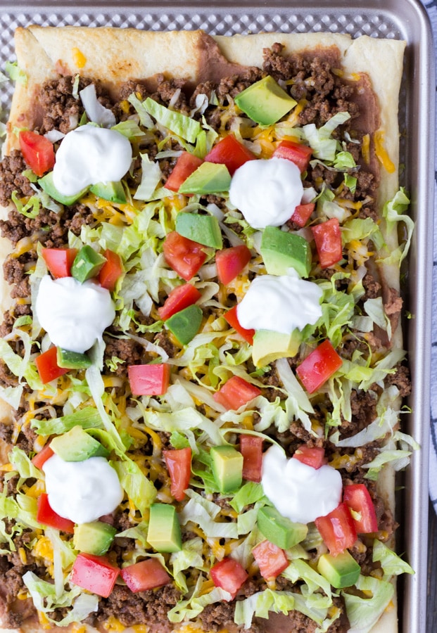 Overhead view of Crescent Dough Taco Pizza on a baking sheet.