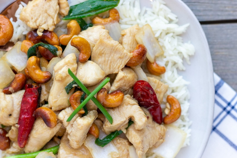 Thai Cashew Chicken Stir fry with roasted chili peppers, onions, juicy chicken, and crunchy cashews