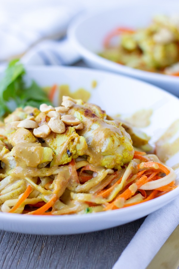 Spiralized zucchini and carrots topped with Thai chicken Satay and a creamy peanut sauce.